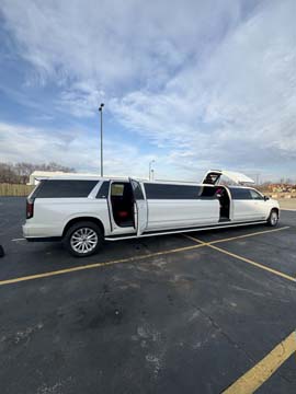 White stretch limousine parked with doors open