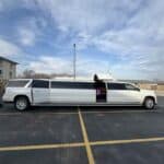 White stretch limousine parked in empty lot