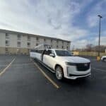 White stretch limousine parked in empty lot