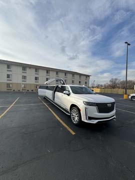 White stretch limousine parked in empty lot