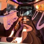 Luxury limousine interior with neon lighting and bar