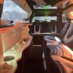 Luxury limousine interior with leather seats and champagne glasses