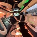 Luxury limousine interior with leather seats and ambient lighting