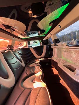 Luxury limousine interior with leather seats and ambient lighting
