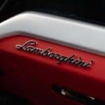 Lamborghini logo on red car interior panel
