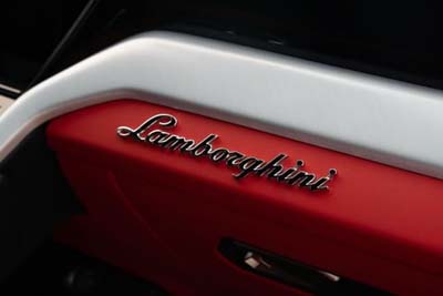 Lamborghini logo on red car interior panel