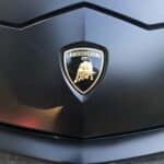 Lamborghini emblem on black car hood