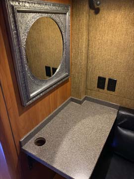 Small dressing room vanity with mirror and countertop