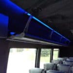 Modern bus interior with blue LED lighting