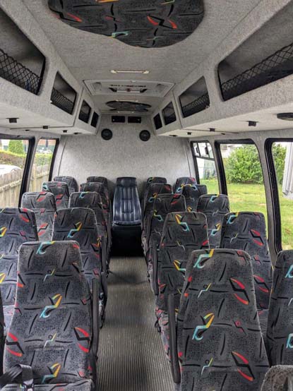 Interior of a passenger minibus with patterned seats