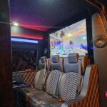 Luxury van interior with leather seats and large screen