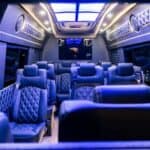 Luxury van interior with blue lighting and leather seats