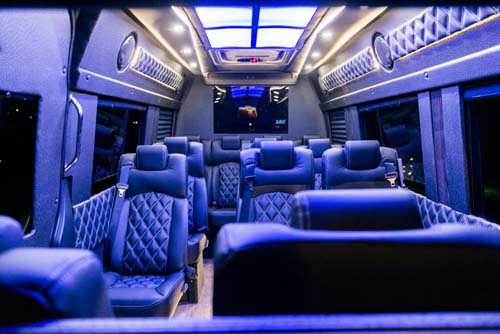 Luxury van interior with blue lighting and leather seats