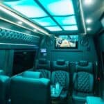 Luxury van interior with leather seats and TV