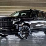 Black full-size SUV in parking garage