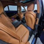 Luxury Bentley rear seat interior with tan leather