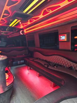 Red neon-lit luxury limousine interior seating area