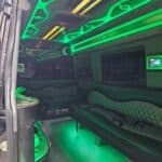 Green neon-lit limousine interior with leather seating