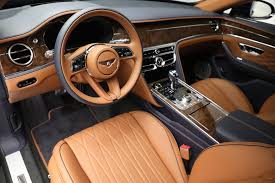Luxury car interior with tan leather seats and dashboard