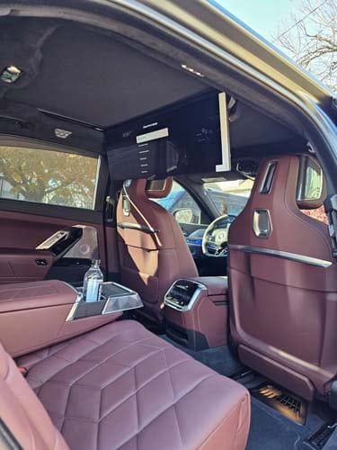 Luxury car interior with rear entertainment screen