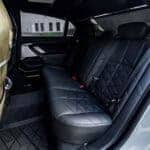 Black leather rear seats inside luxury car
