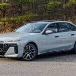 Silver BMW sedan parked on roadside