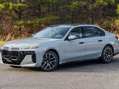 Silver BMW sedan parked on roadside