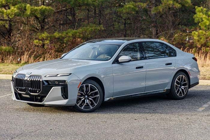 Silver BMW sedan parked on roadside