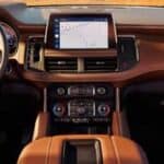 Modern car interior with touchscreen dashboard and steering wheel