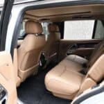 Beige leather rear seats inside modern SUV