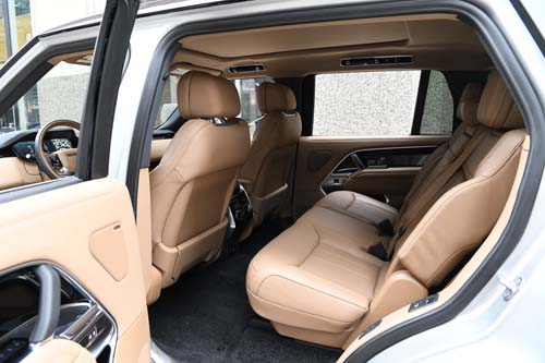 Beige leather rear seats inside modern SUV
