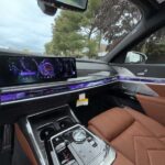 Luxury car interior with digital dashboard and brown leather seats