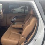 Tan leather rear seats inside a white SUV