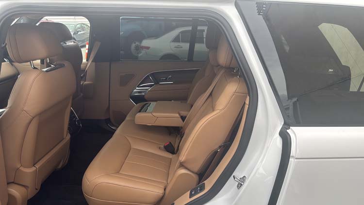 Tan leather rear seats inside a white SUV
