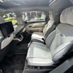 Luxury car rear seats with white leather interior
