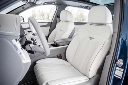 Modern car interior with white leather front seats