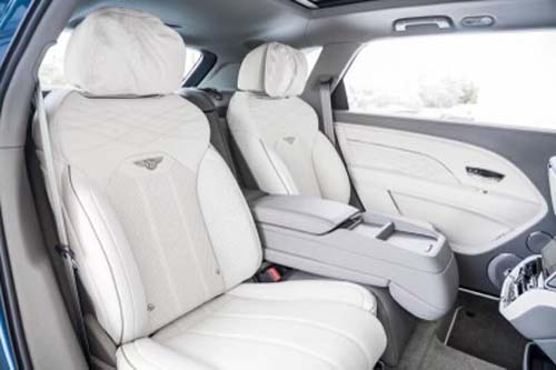 Luxury car interior with white leather seats