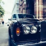 Black Rolls-Royce parked on city street