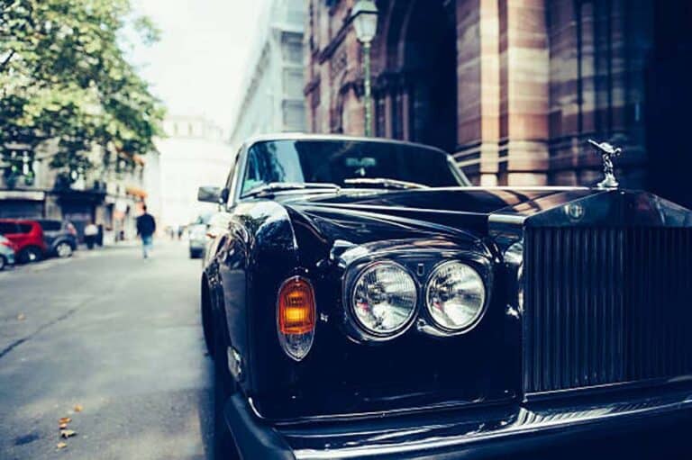 Black Rolls-Royce parked on city street