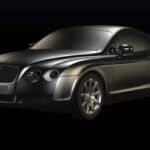 Black luxury sports coupe on dark background