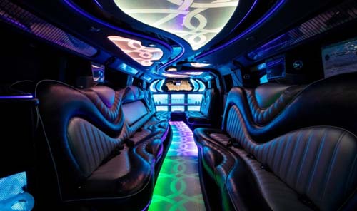 Luxury limousine interior with neon lighting and leather seats