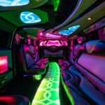 Neon-lit luxury limousine interior with colorful LED lighting