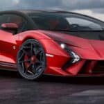 Red Lamborghini sports car on wet road