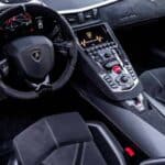 Lamborghini sports car interior with steering wheel and console