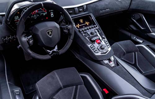 Lamborghini sports car interior with steering wheel and console