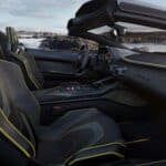 Luxury convertible sports car interior with yellow stitching