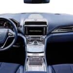 Luxury car interior with steering wheel and dashboard