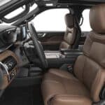 Luxury car interior with brown leather seats and dashboard