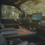 Luxury SUV interior with leather seats and touchscreen dashboard