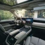 Modern car interior with touchscreen dashboard and sunroof